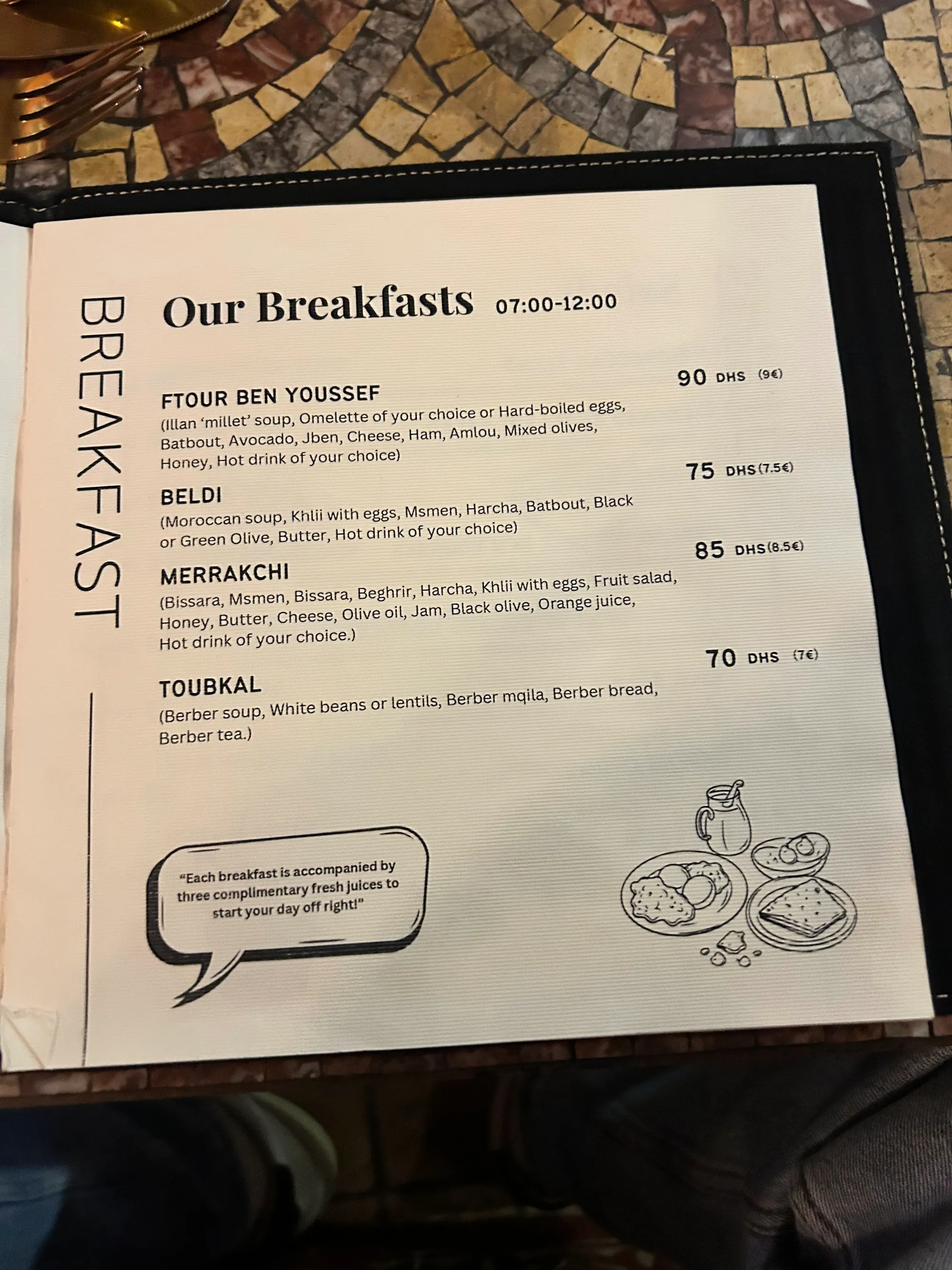 The printed breakfast card, four set breakfasts from 70 to 90 DH