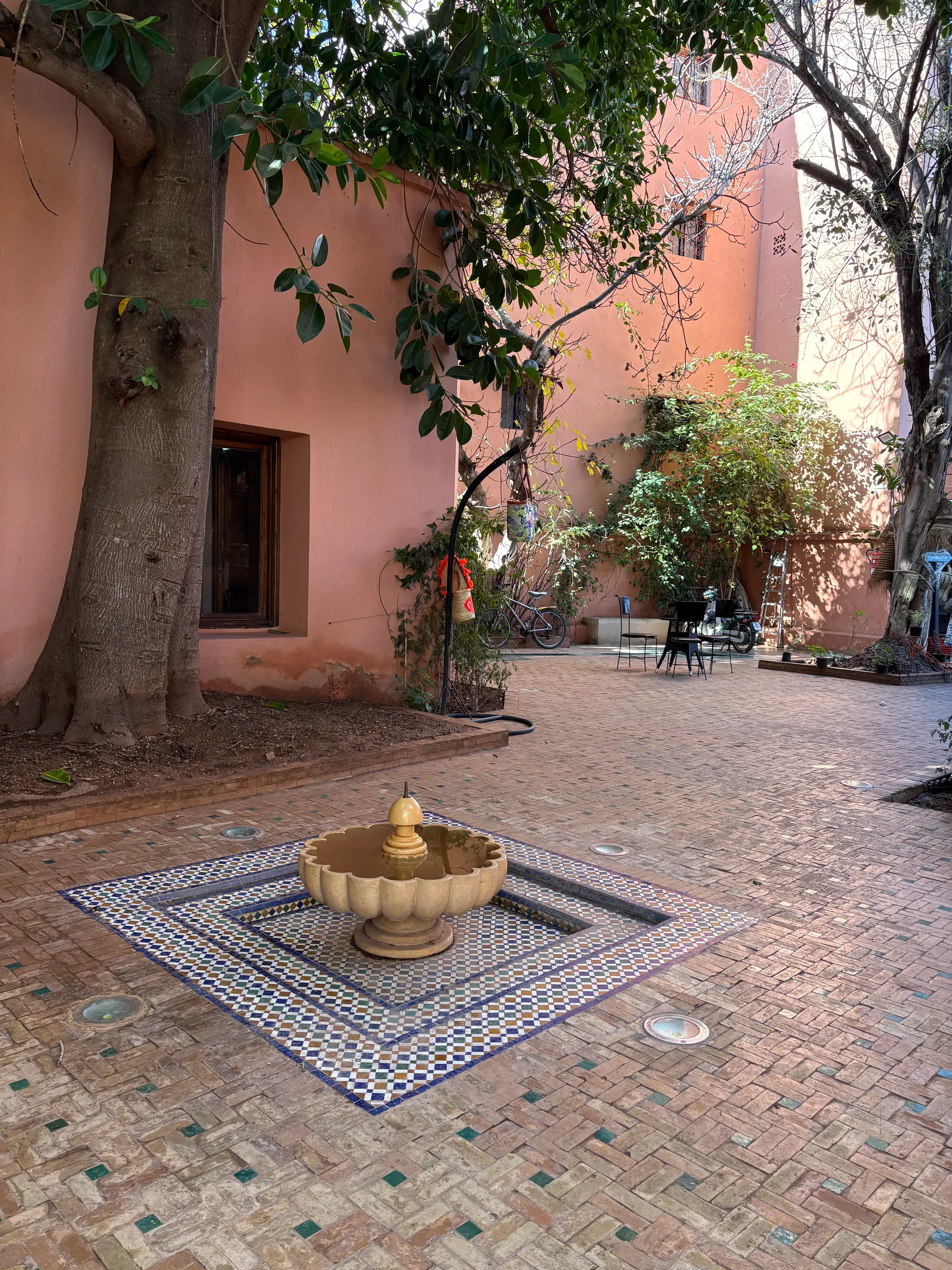 The riad courtyard and its central zellige fountain