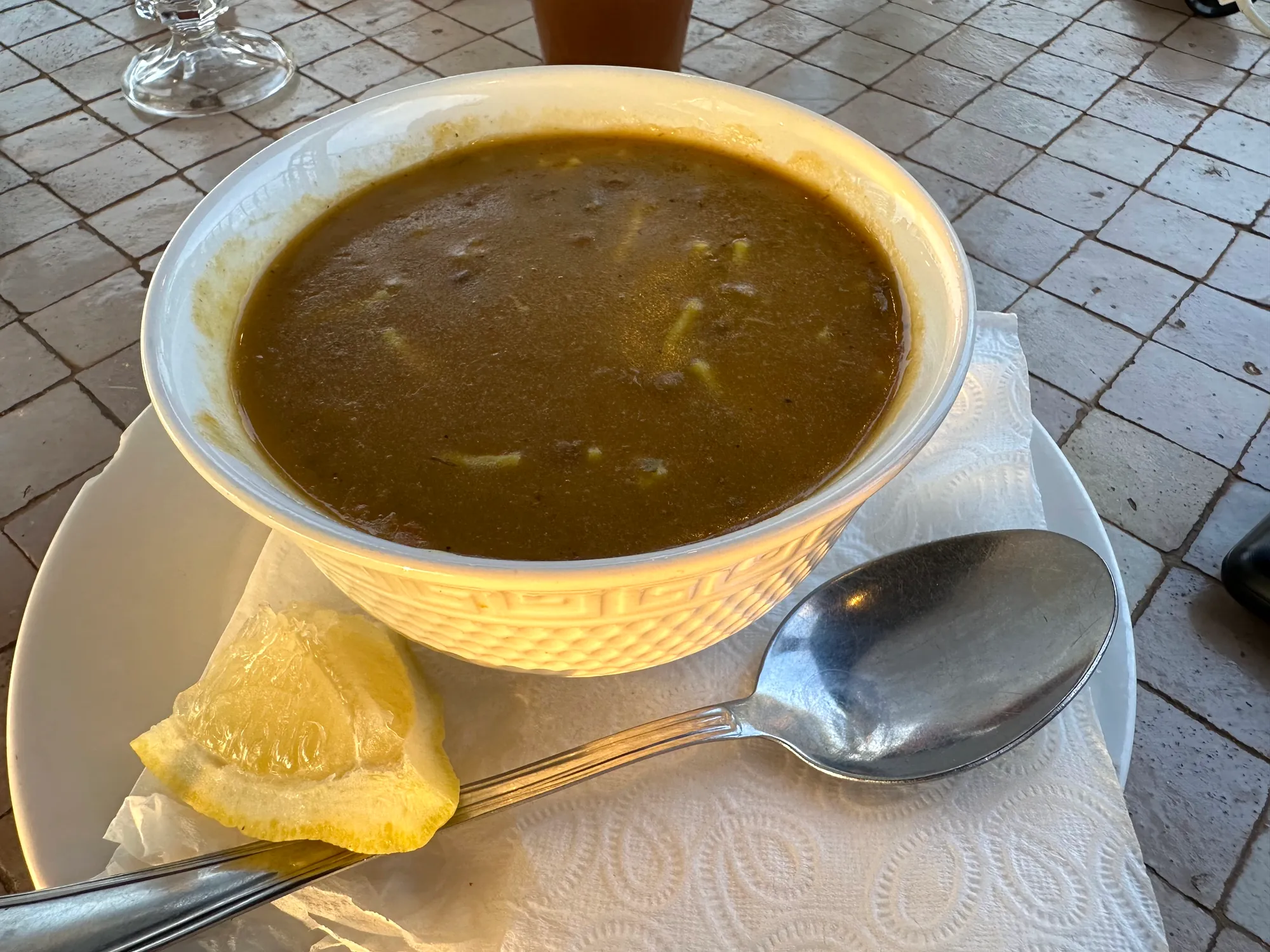 A steaming bowl of harira, the Moroccan tomato and lentil soup